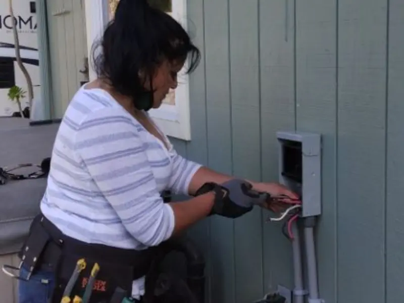 Licensed electrician wiring an exterior subpanel in Chanhassen