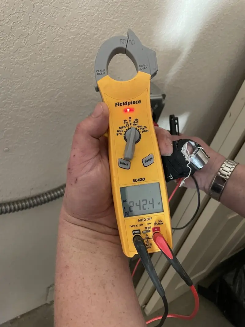 Voltage testing with clamp meter during Circuit Breaker Repair in Chanhassen